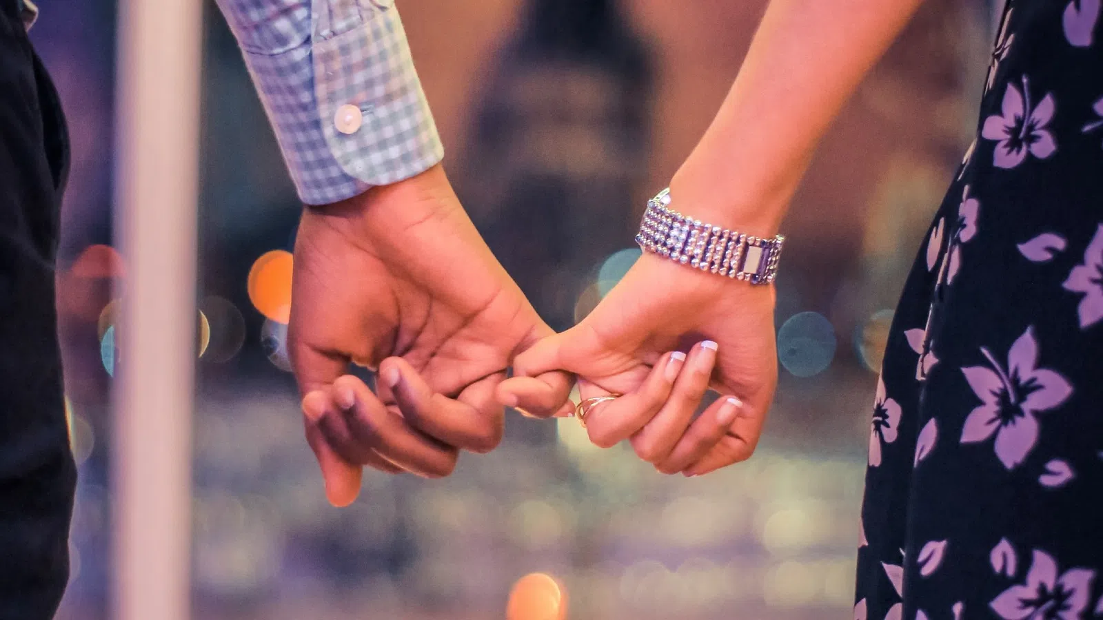 a close-up of hands shaking