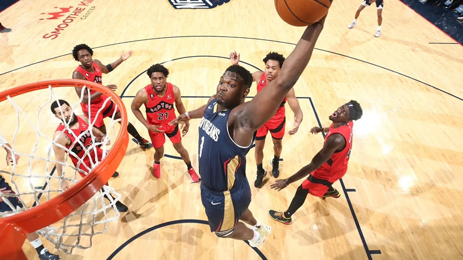 a group of men playing basketball