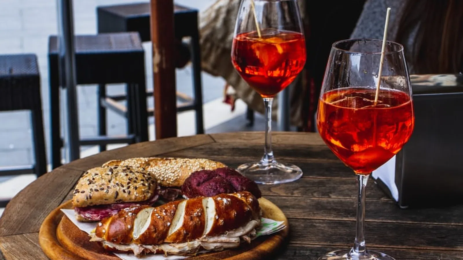 a sandwich and a glass of wine