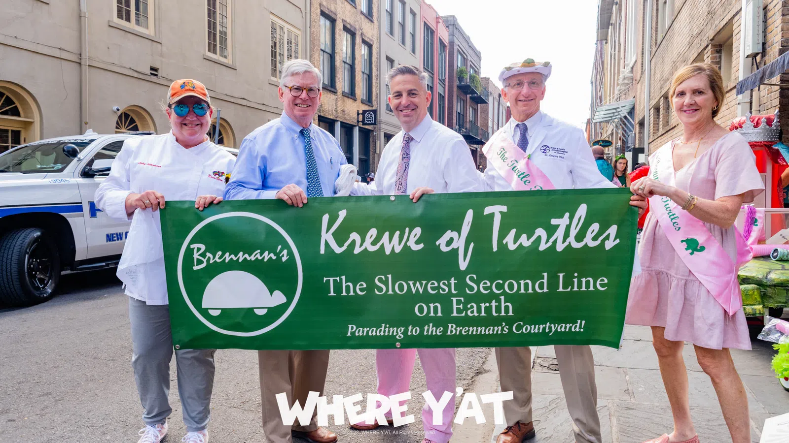 a group of people holding a sign