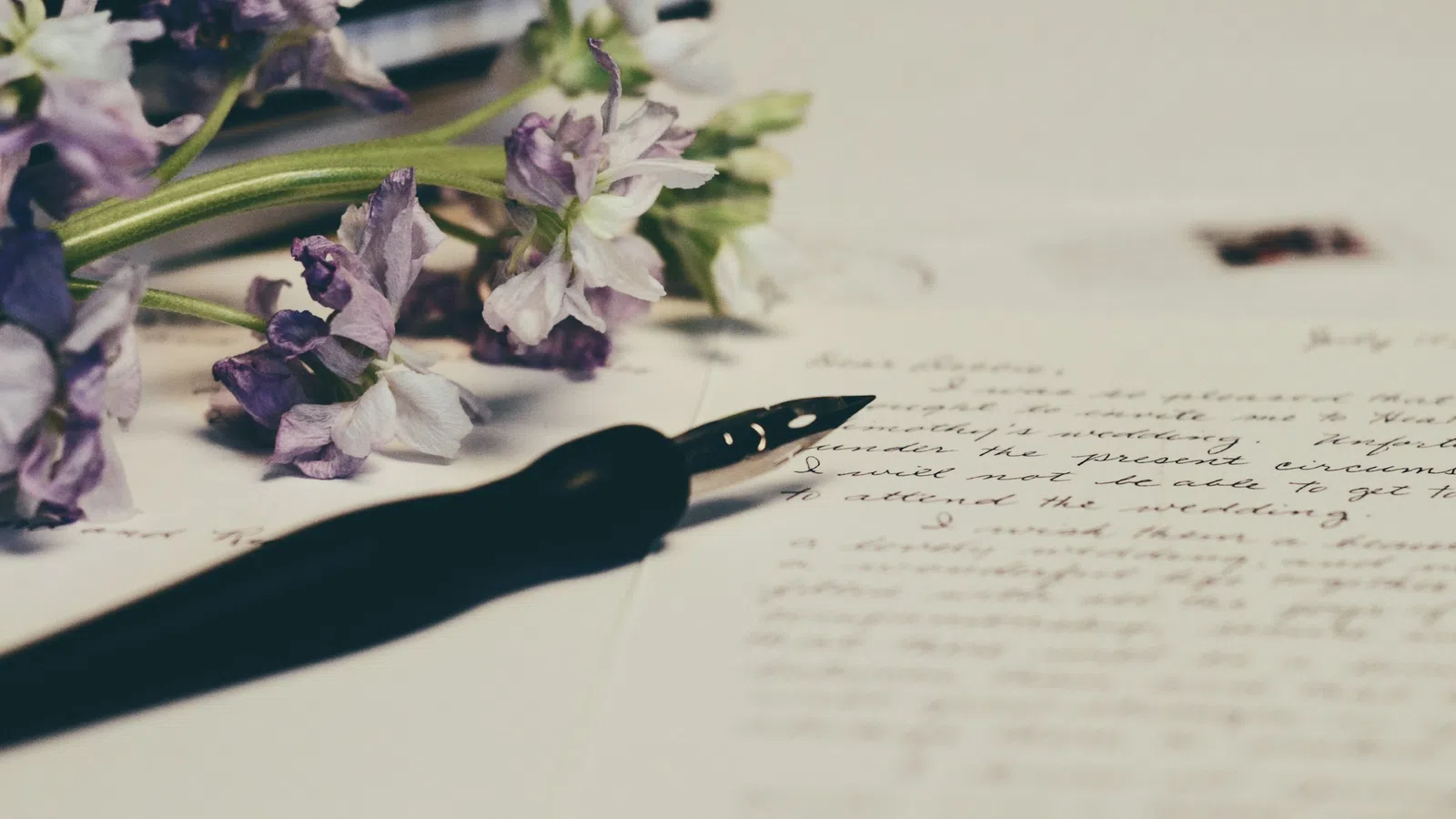 a black pen on a white surface