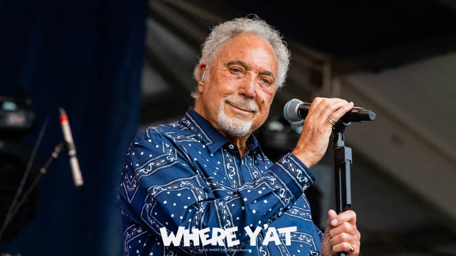 Tom Jones holding a microphone