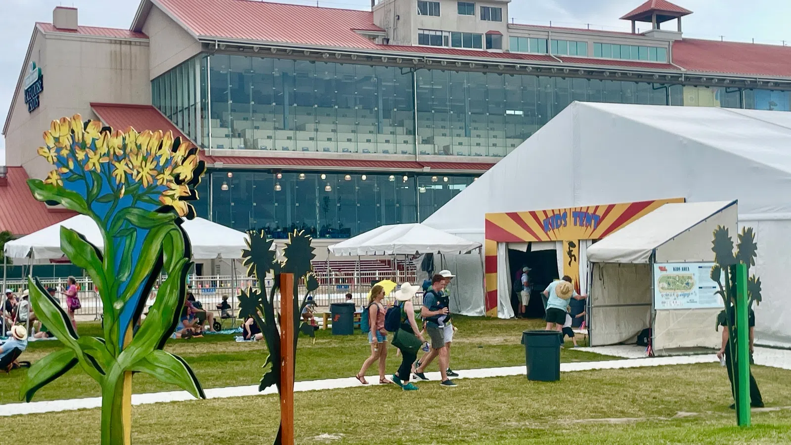 a group of people walking around a fair