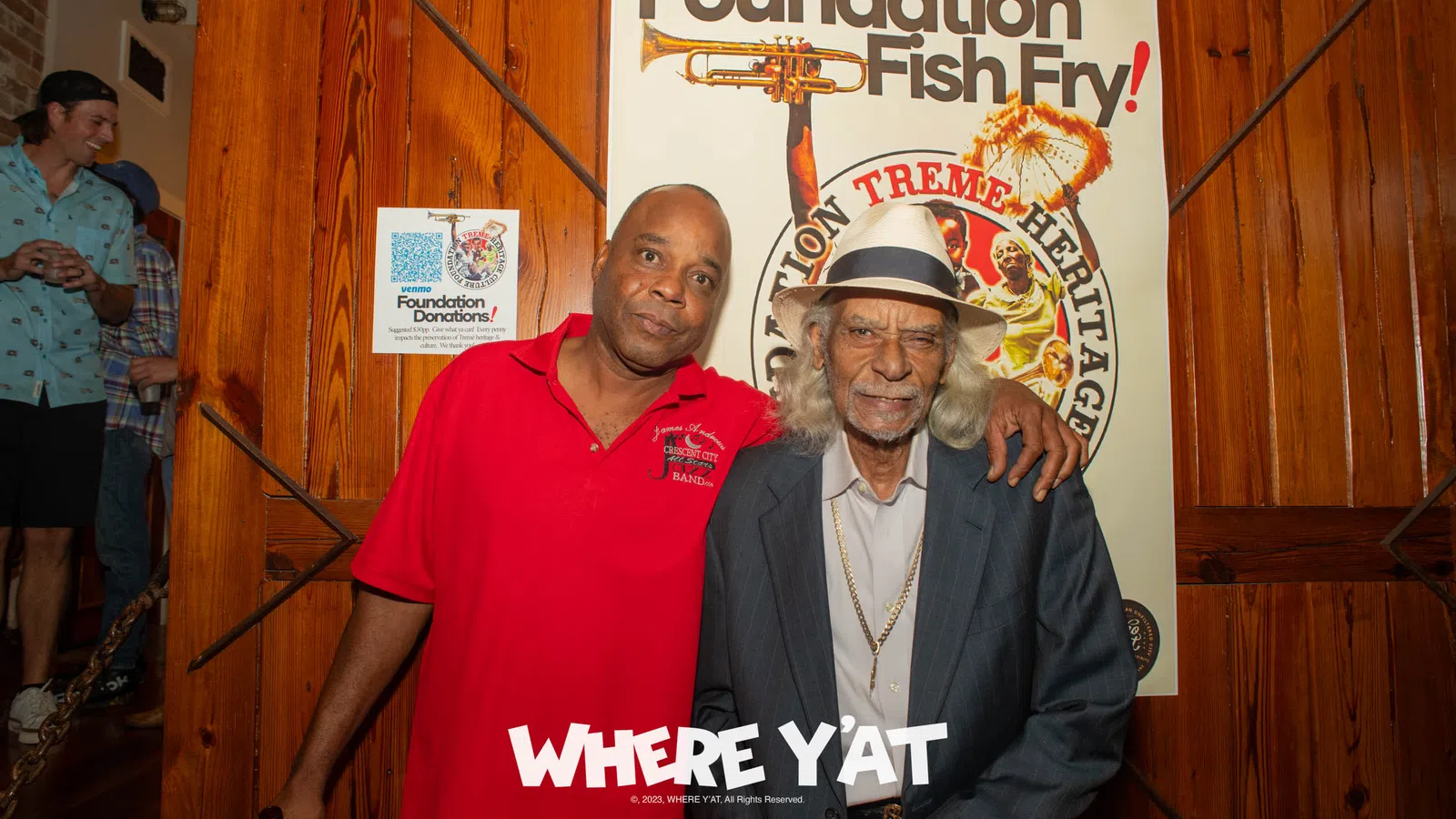 a couple of men posing for the camera