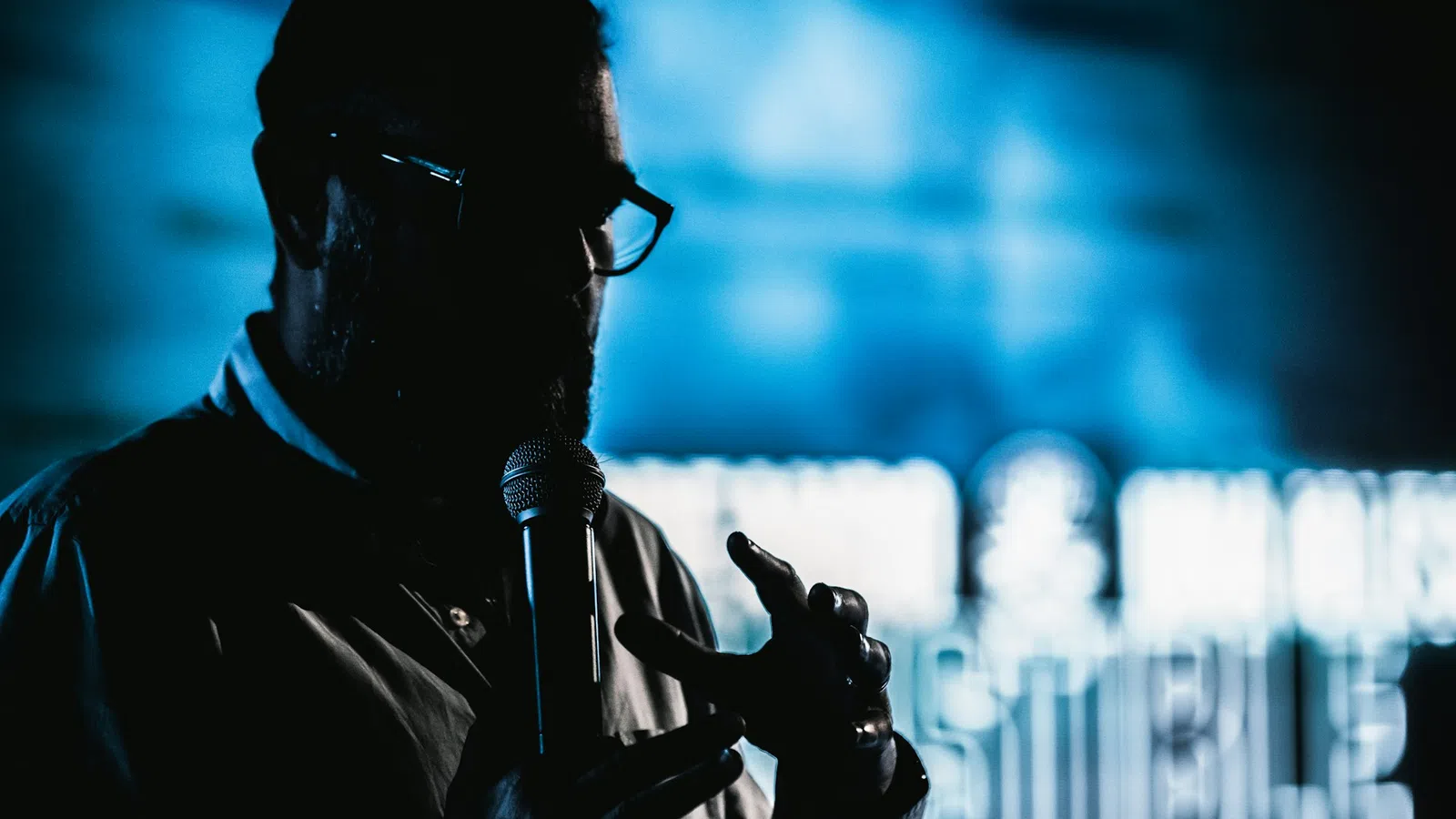 a man wearing a headset and holding a gun