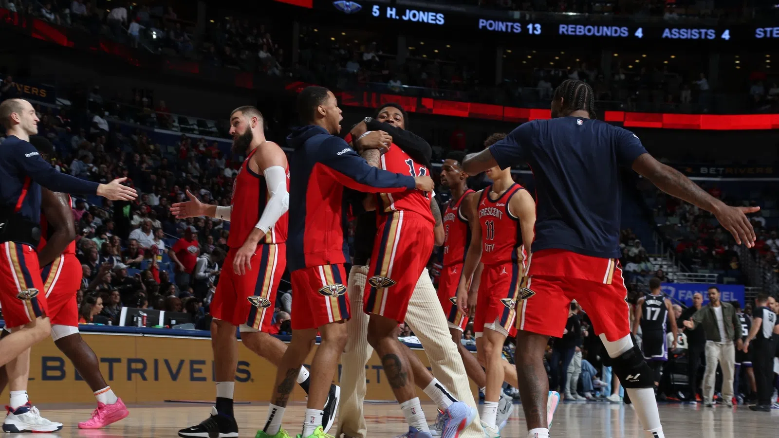 a group of men in basketball uniforms