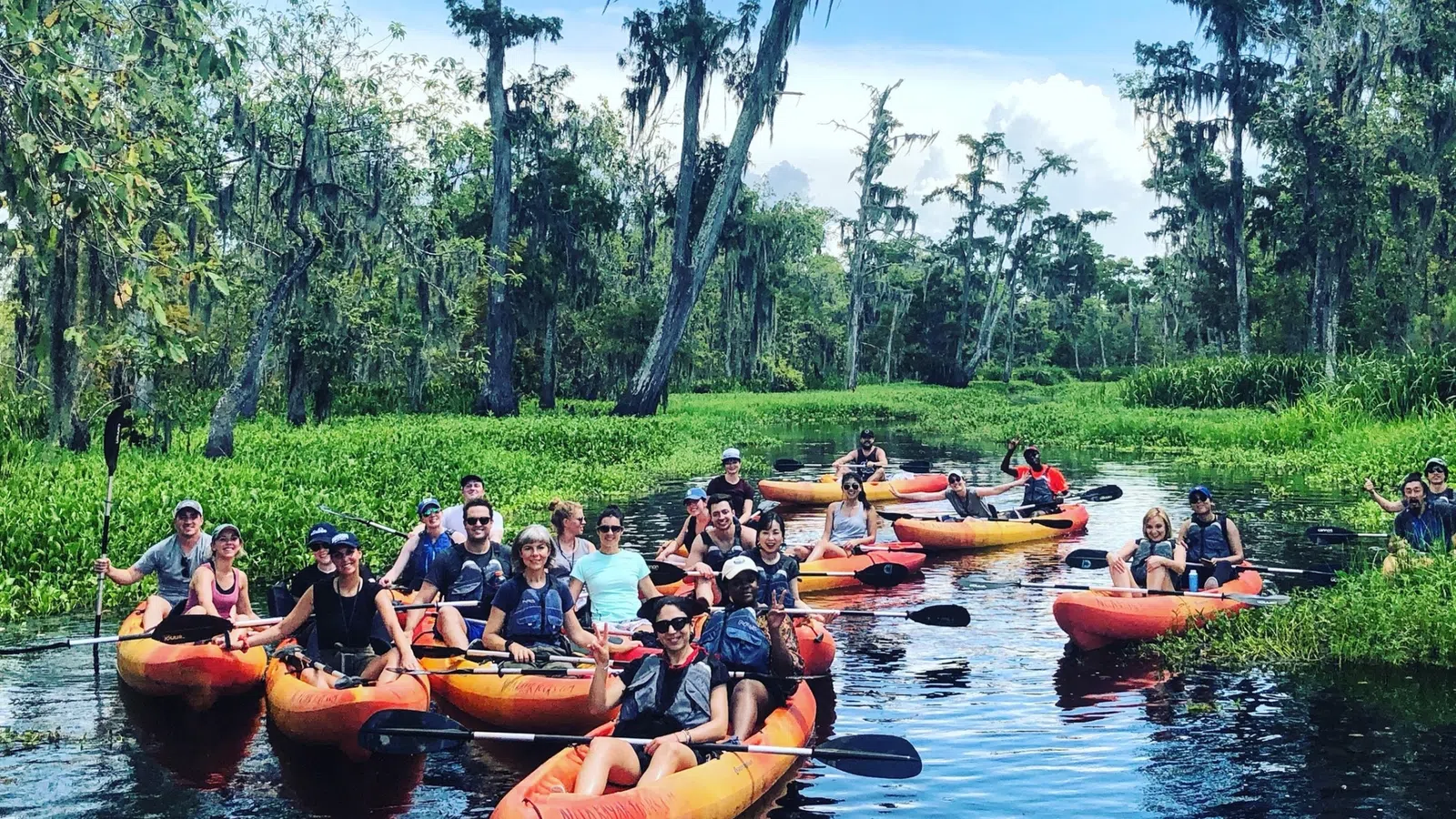 a group of people in canoes on a river