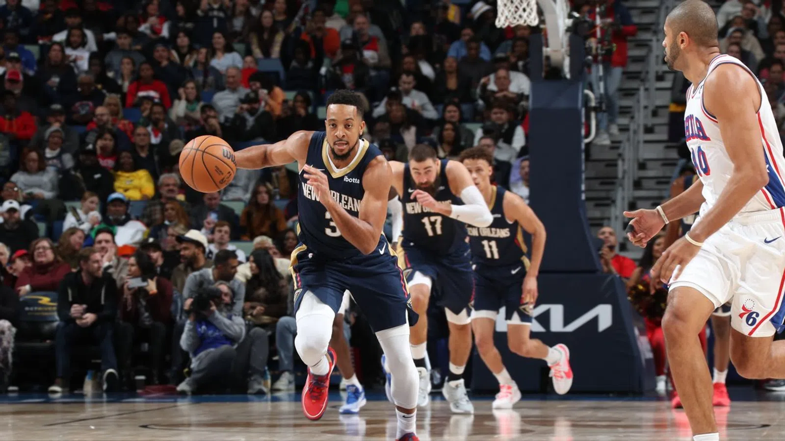 a group of men playing basketball