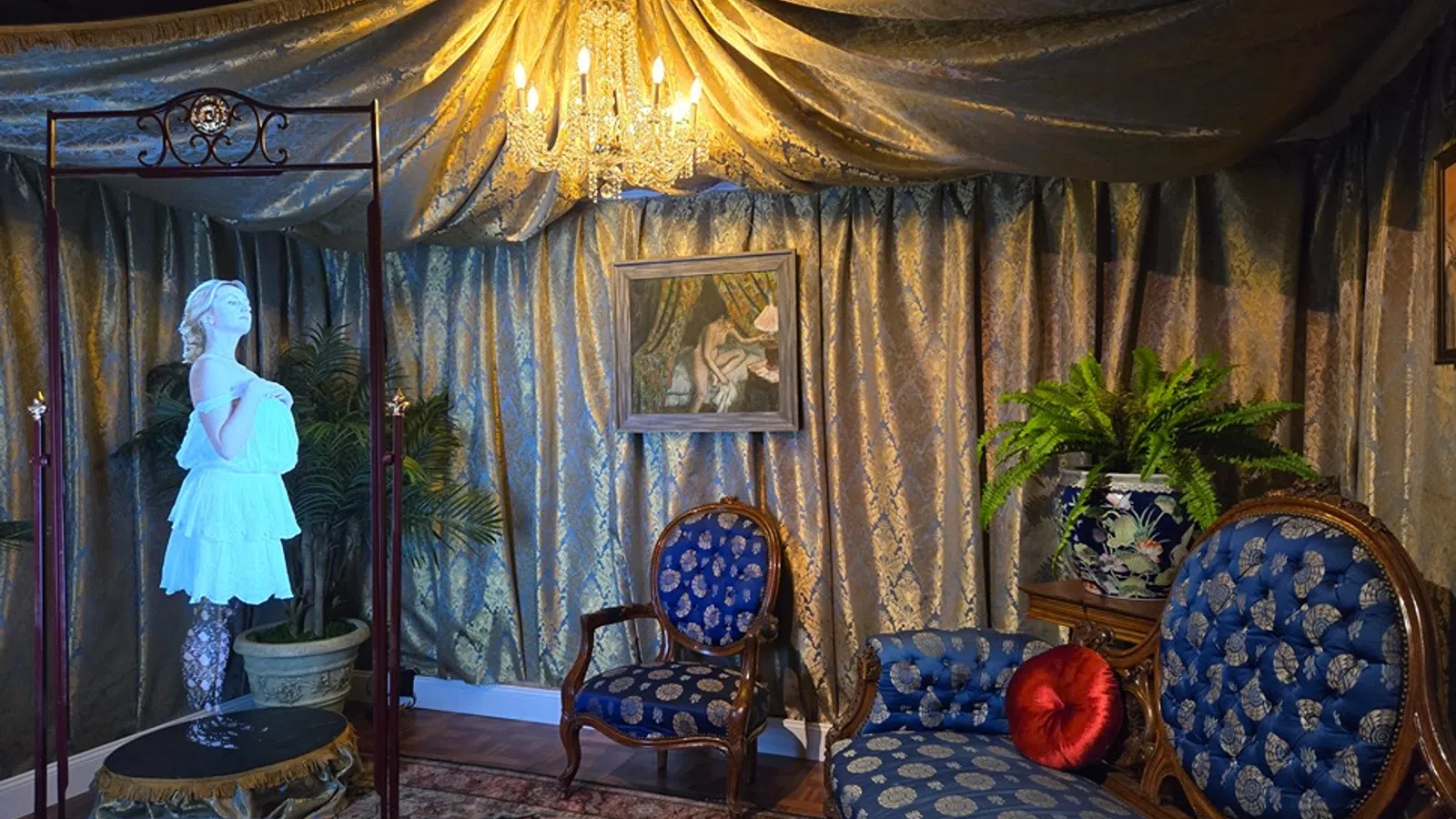 a room with a painting and chairs