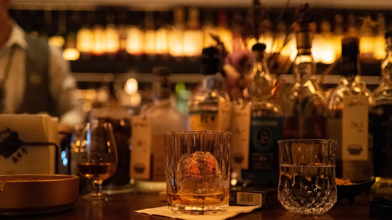 a group of glasses on a bar