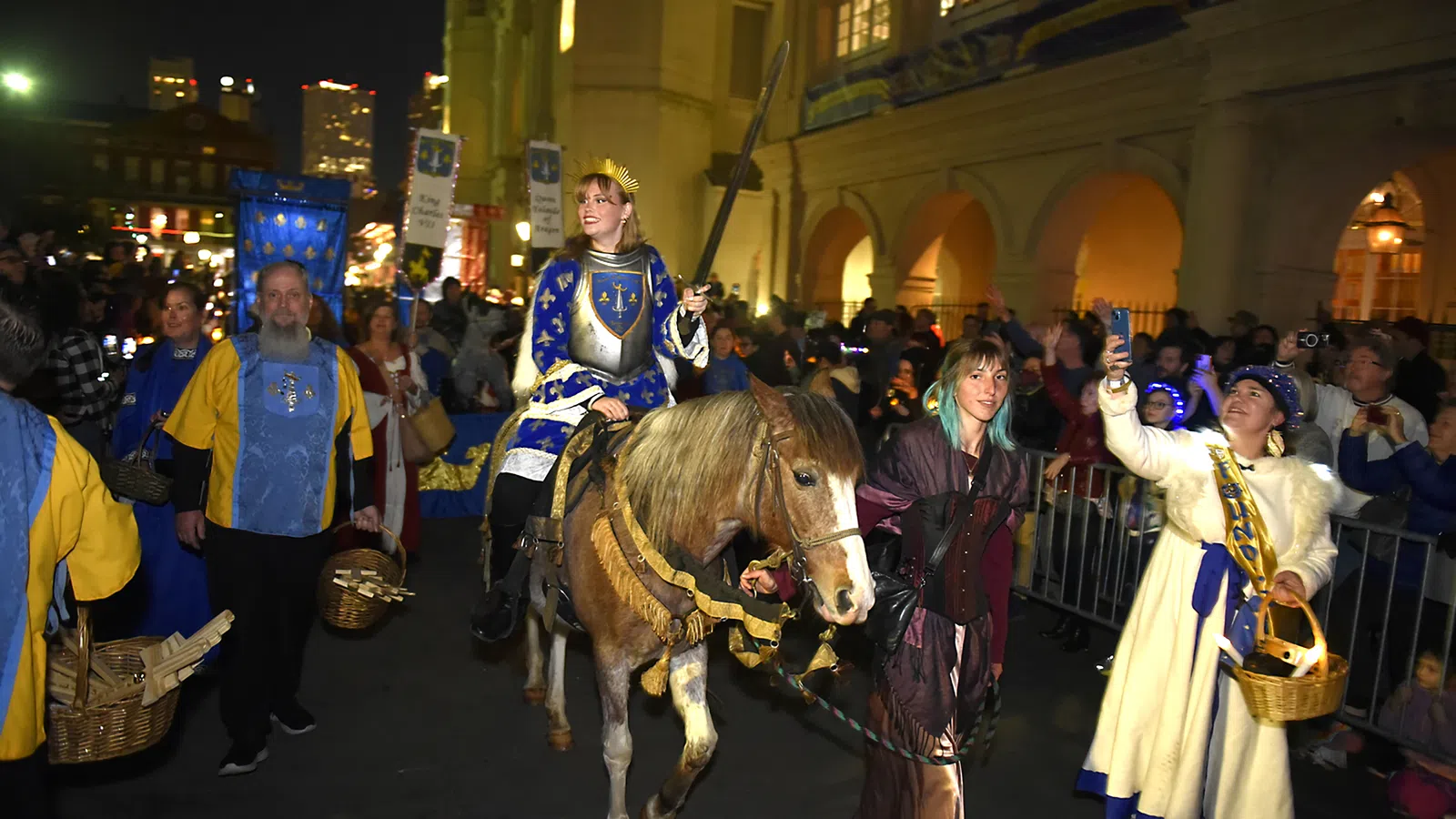 a person riding a horse in a crowded street