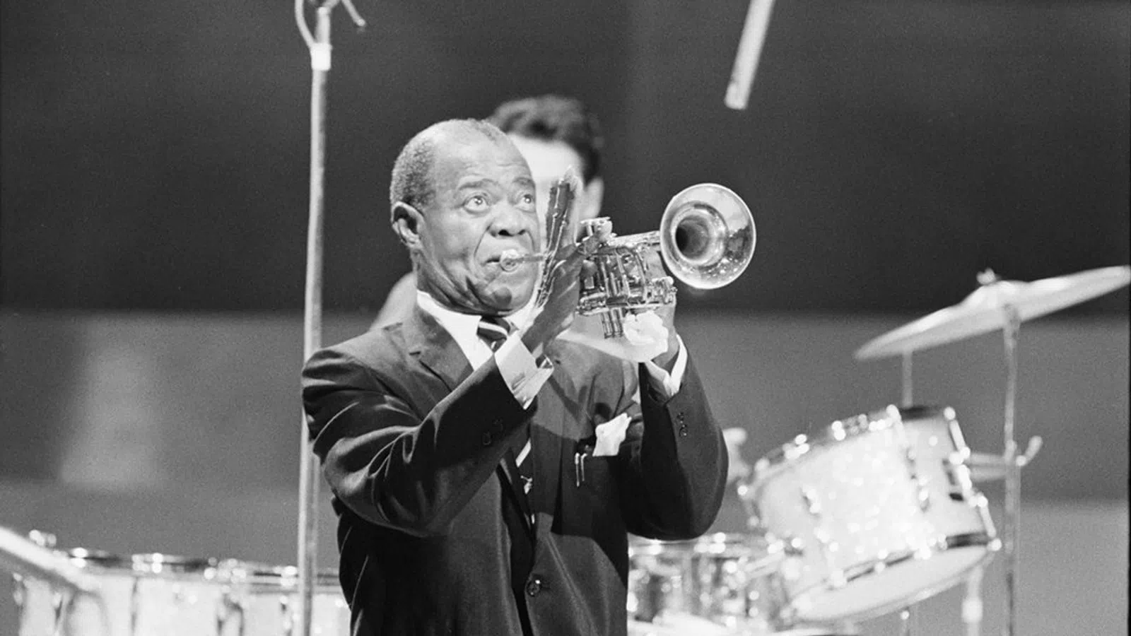 Louis Armstrong playing a trumpet