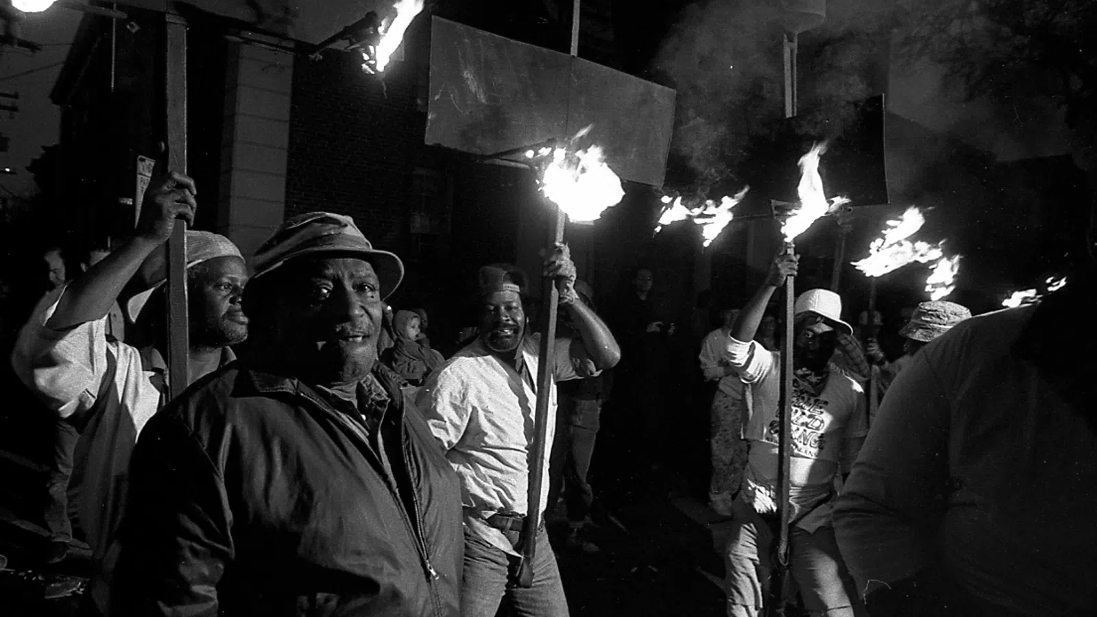 a group of people holding sparklers