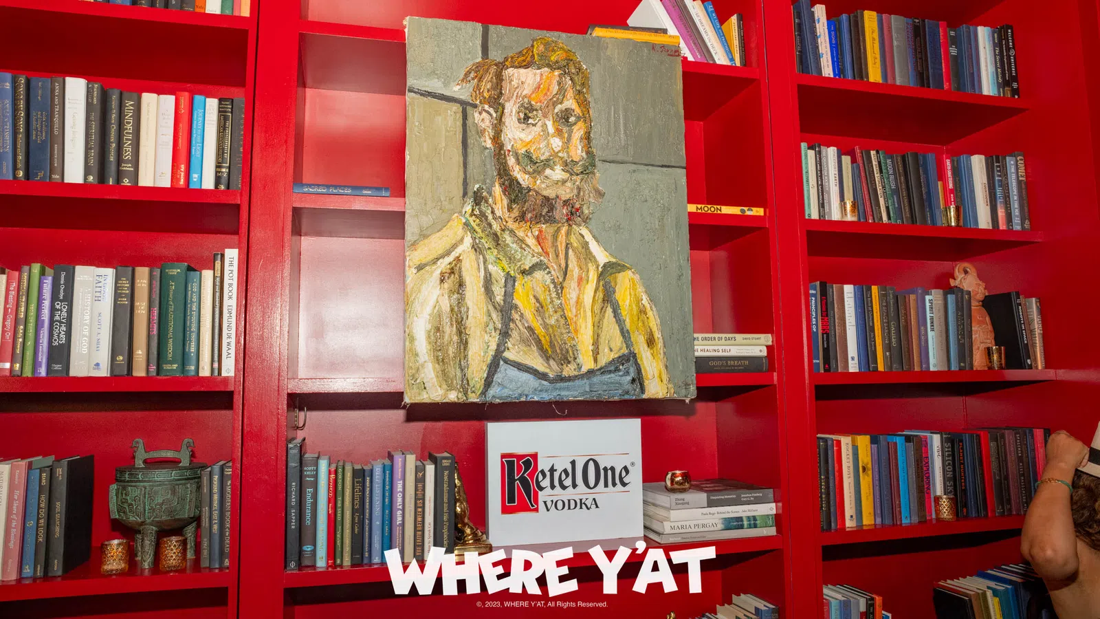 a book shelf with a statue