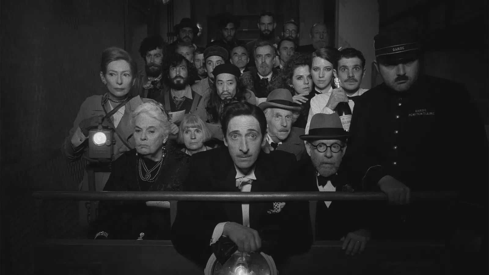 Adrien Brody et al. posing for a photo