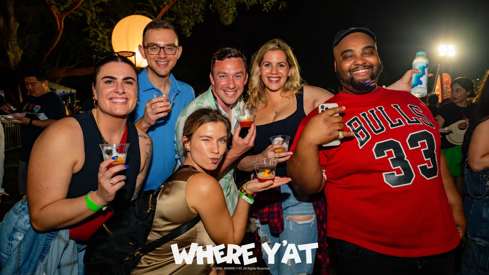 a group of people posing for a photo