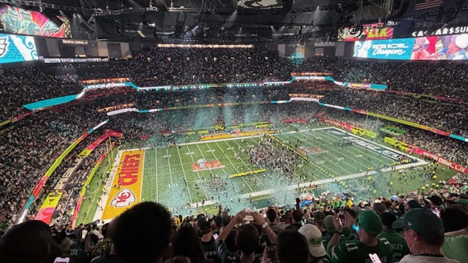 a sports stadium with a field and people in it