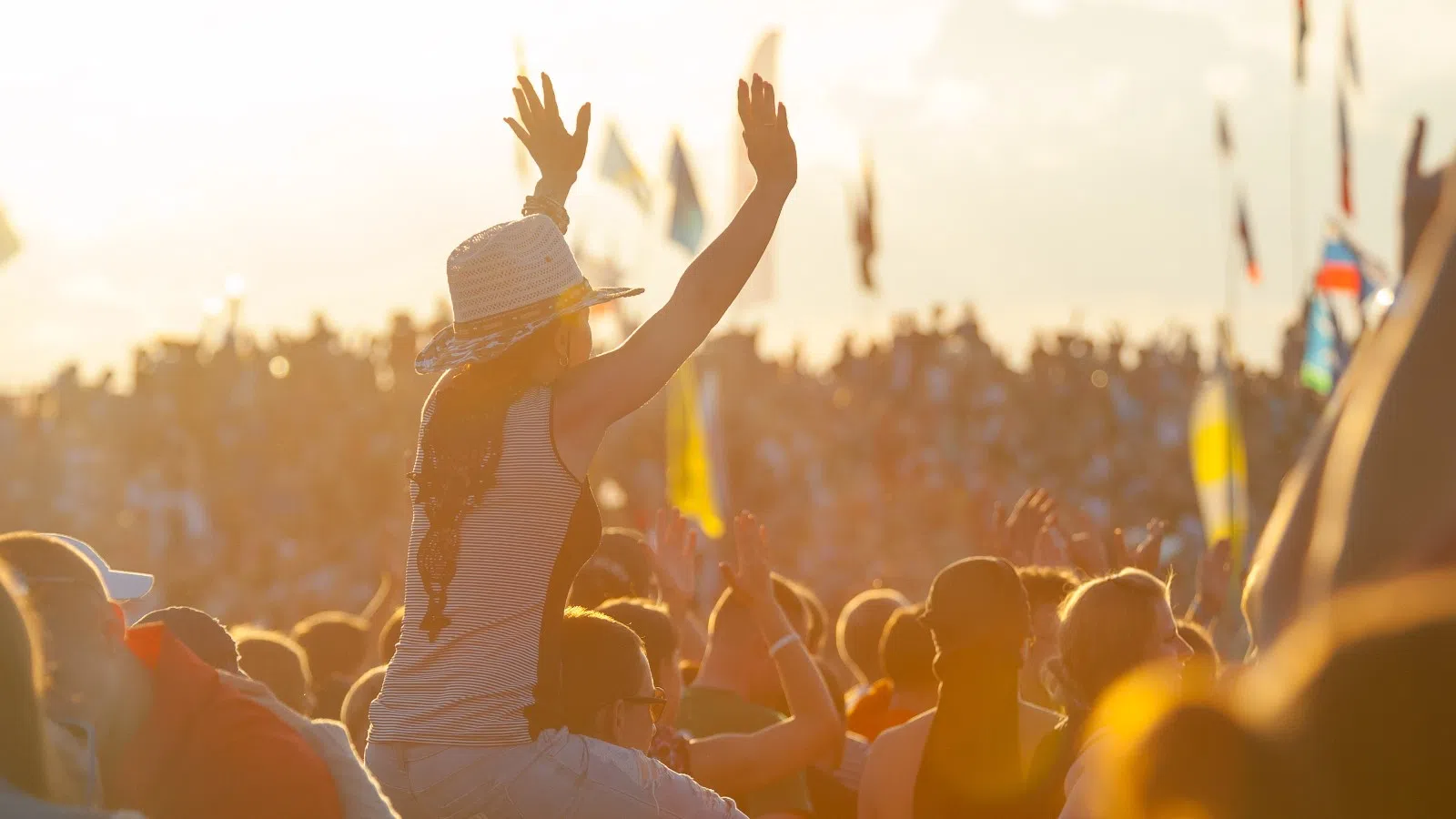 a group of people raising their hands