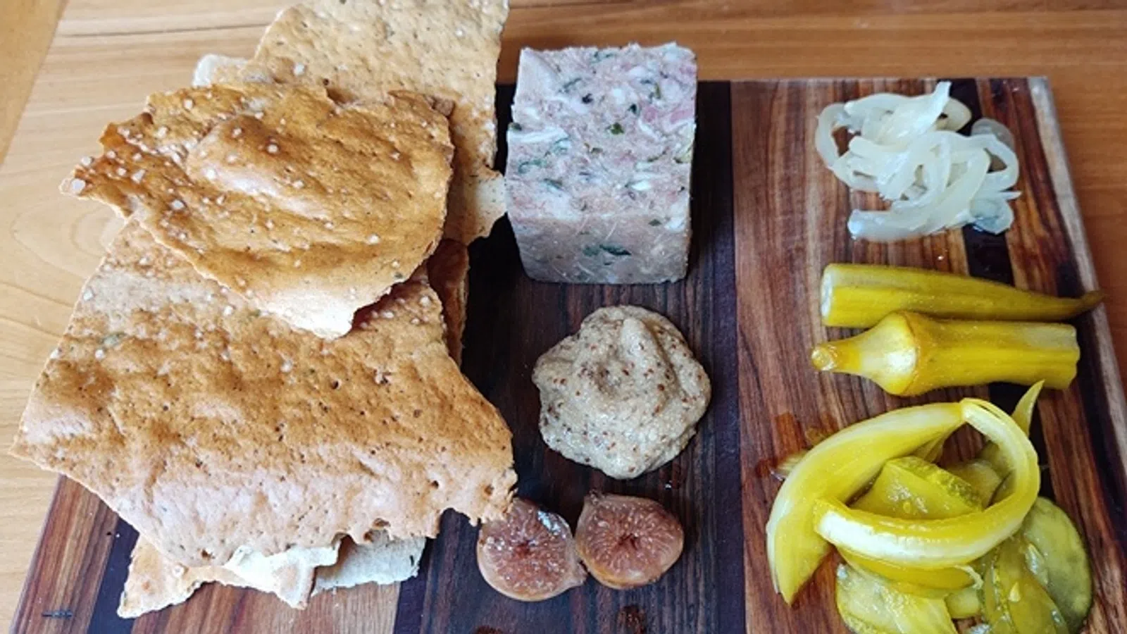 a wooden cutting board with food on it