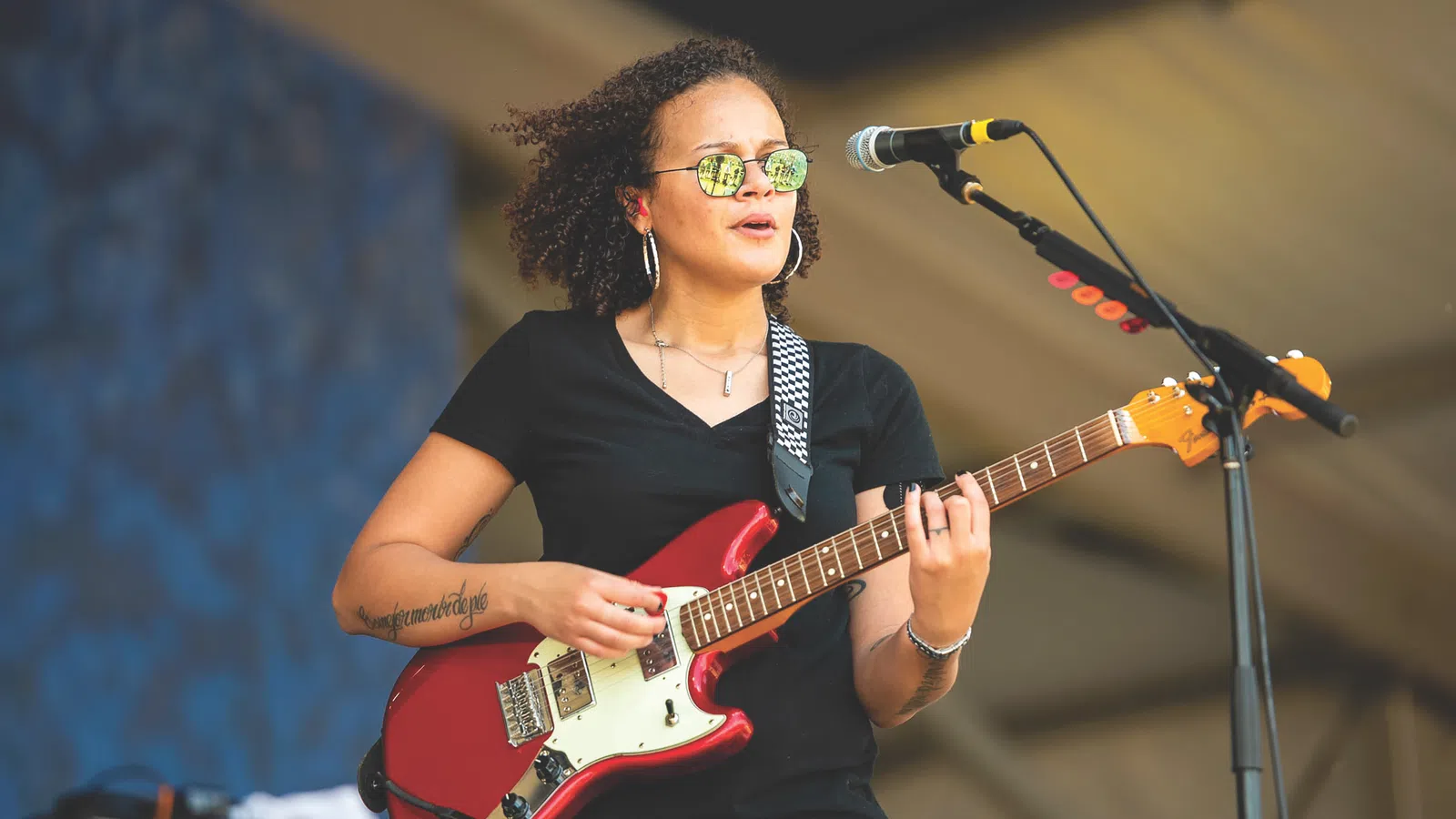 Mia Borders playing a guitar