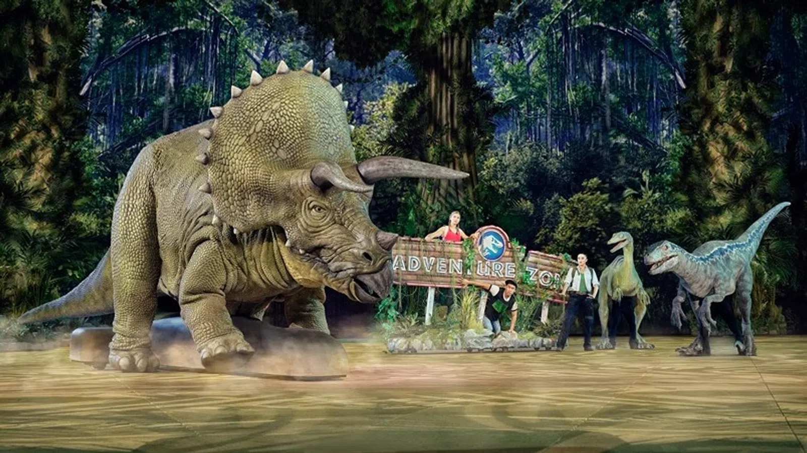 a group of people standing next to a statue of an elephant