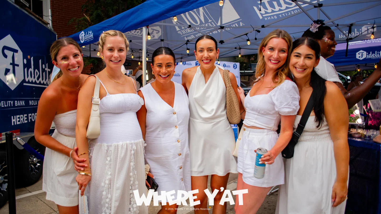 a group of women in white dresses