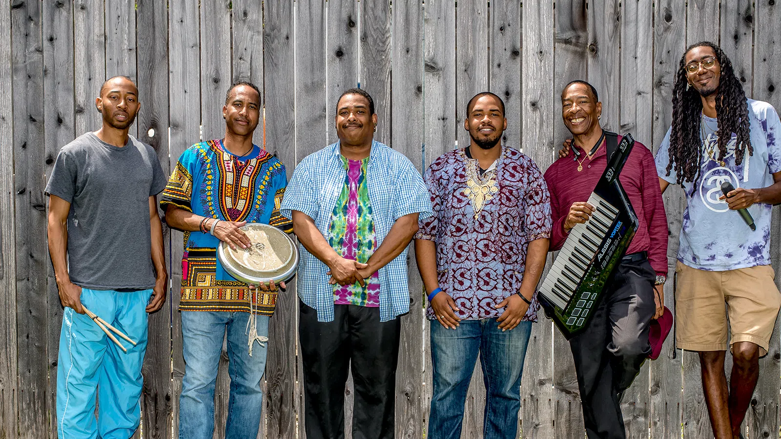 a group of men posing for a photo