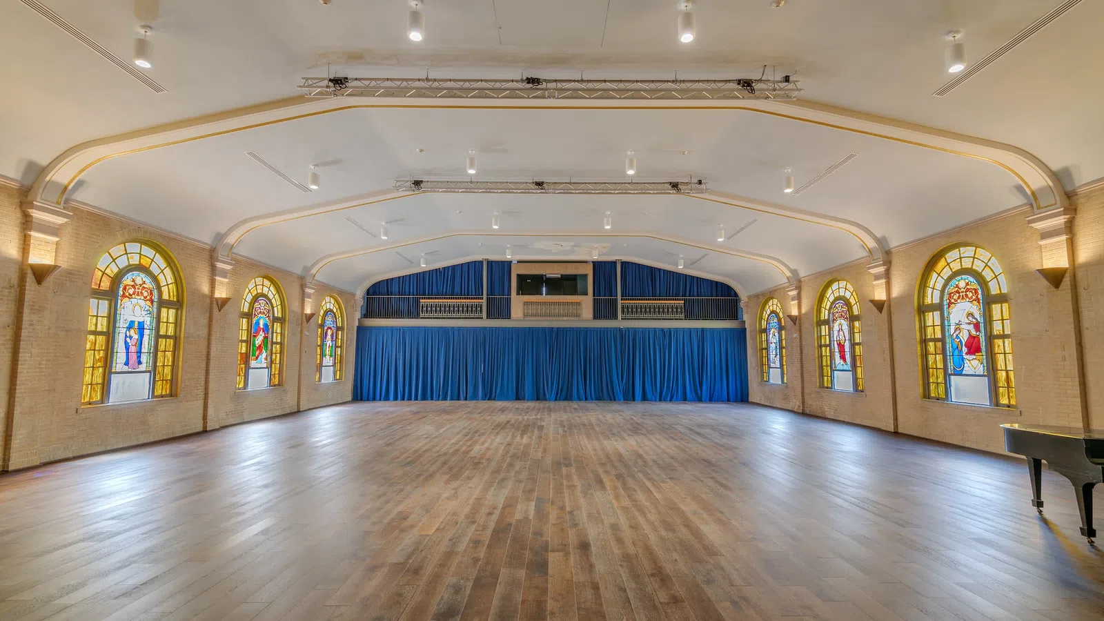 a large room with stained glass windows