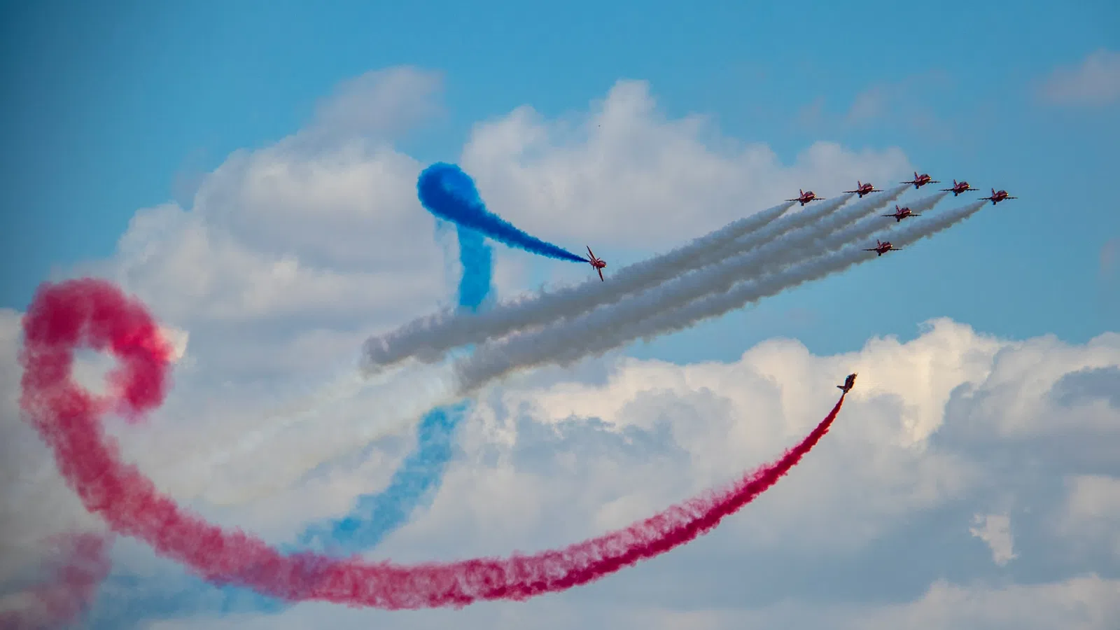 a group of jets flying in formation