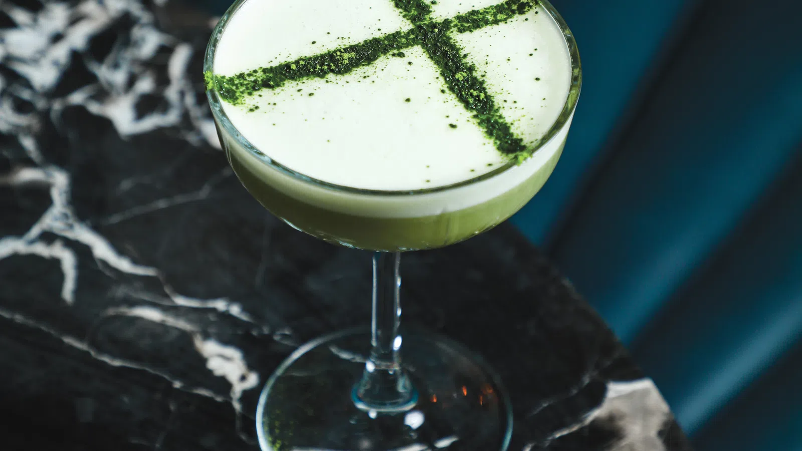 a glass of green liquid
