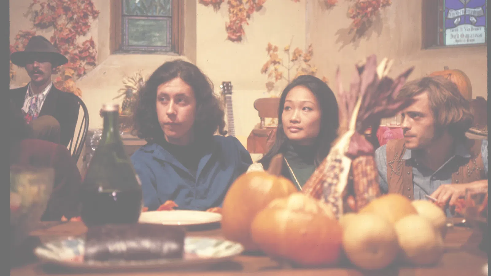 Tina Chen et al. sitting at a table with food