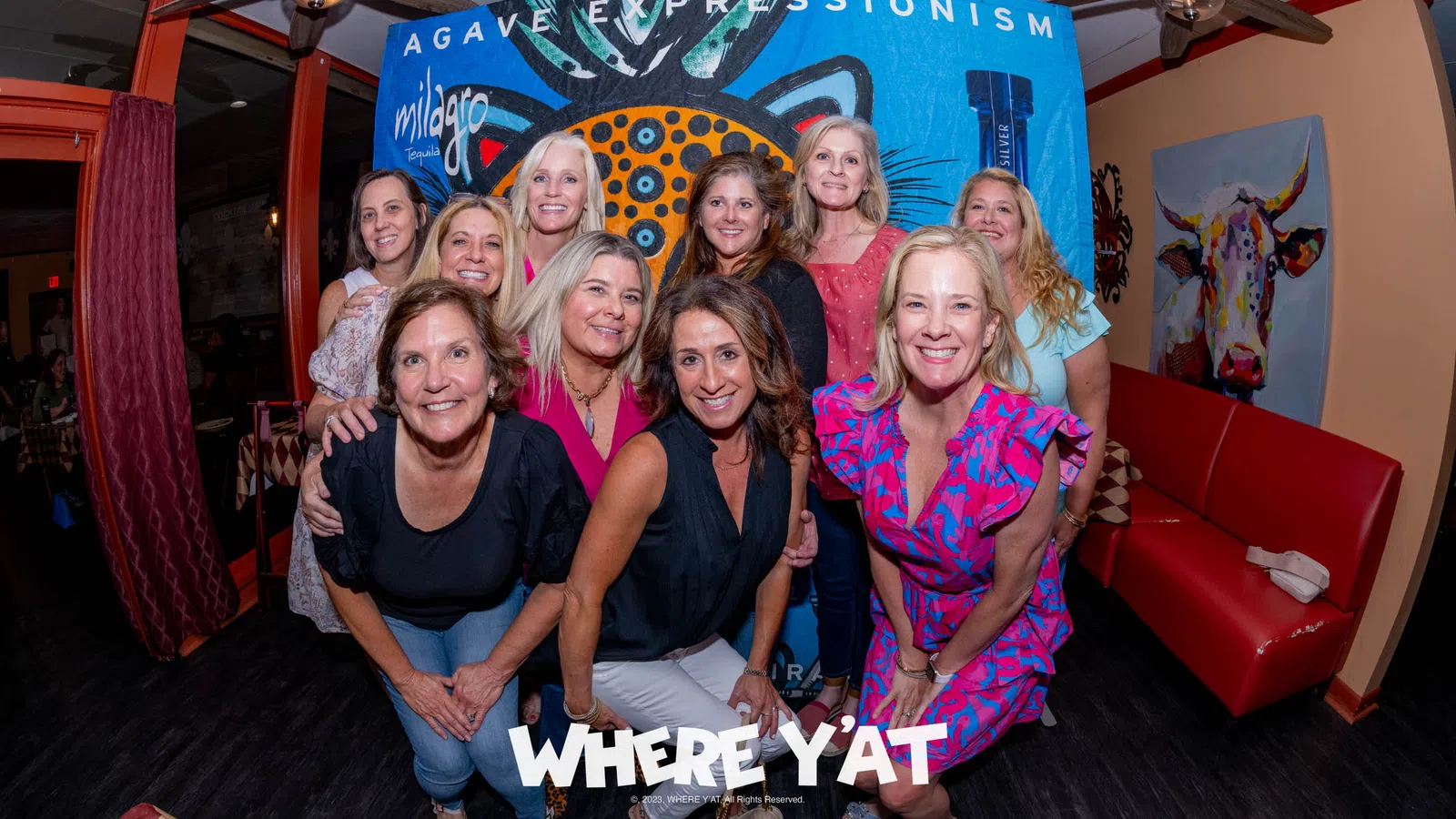 a group of women posing for a photo