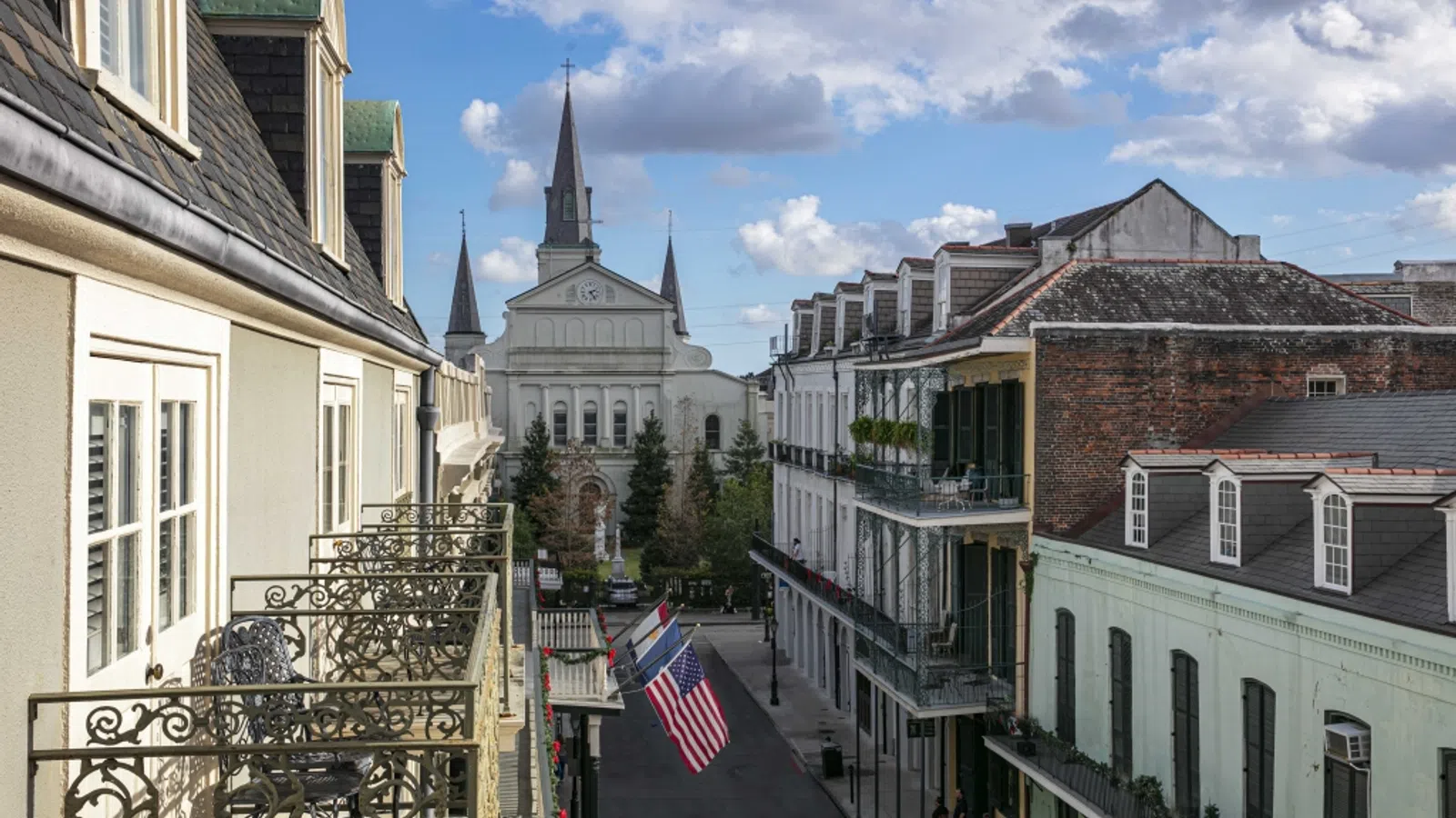 a street with buildings and a flag