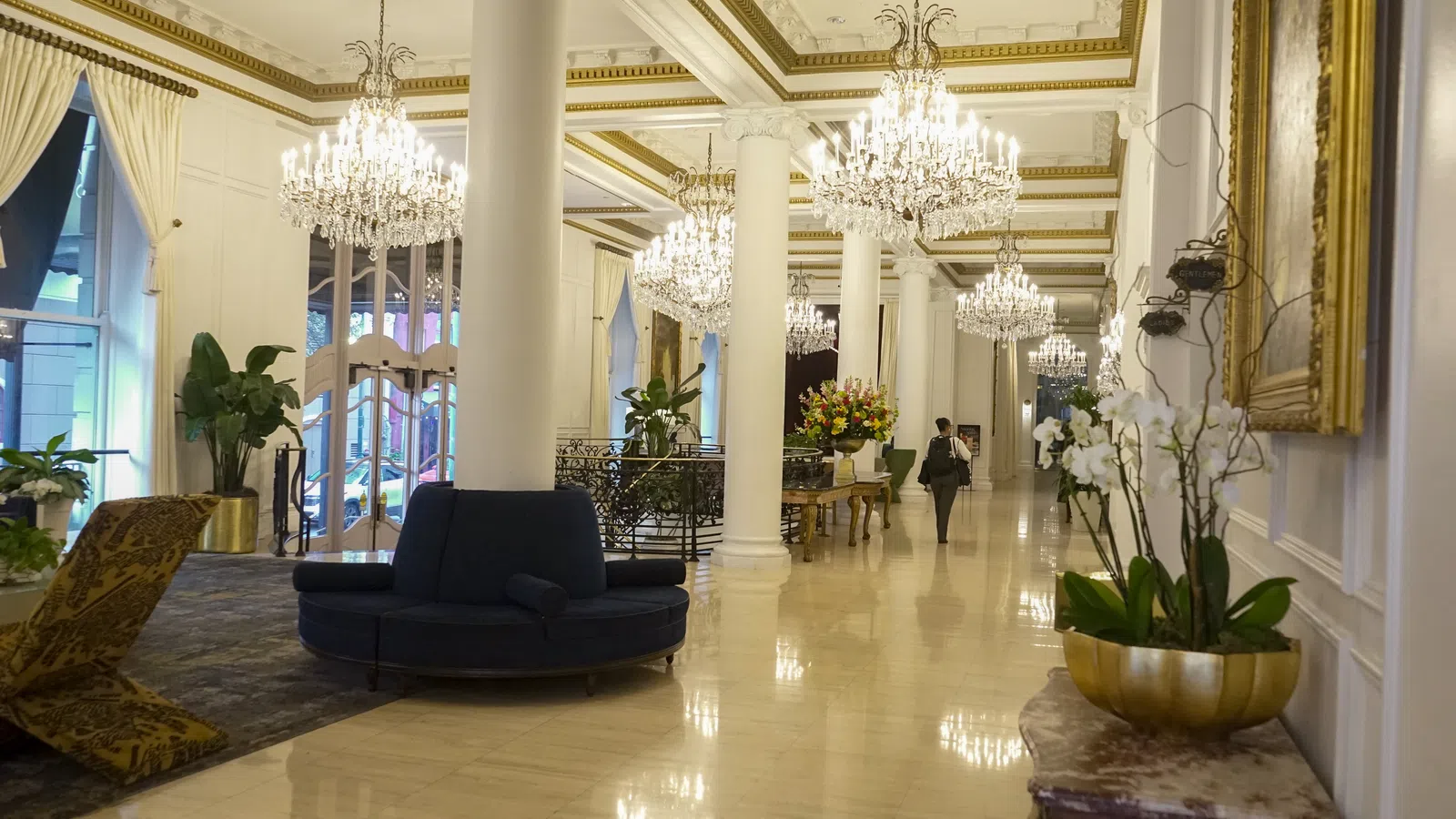 a large room with a couch and a table with a chair