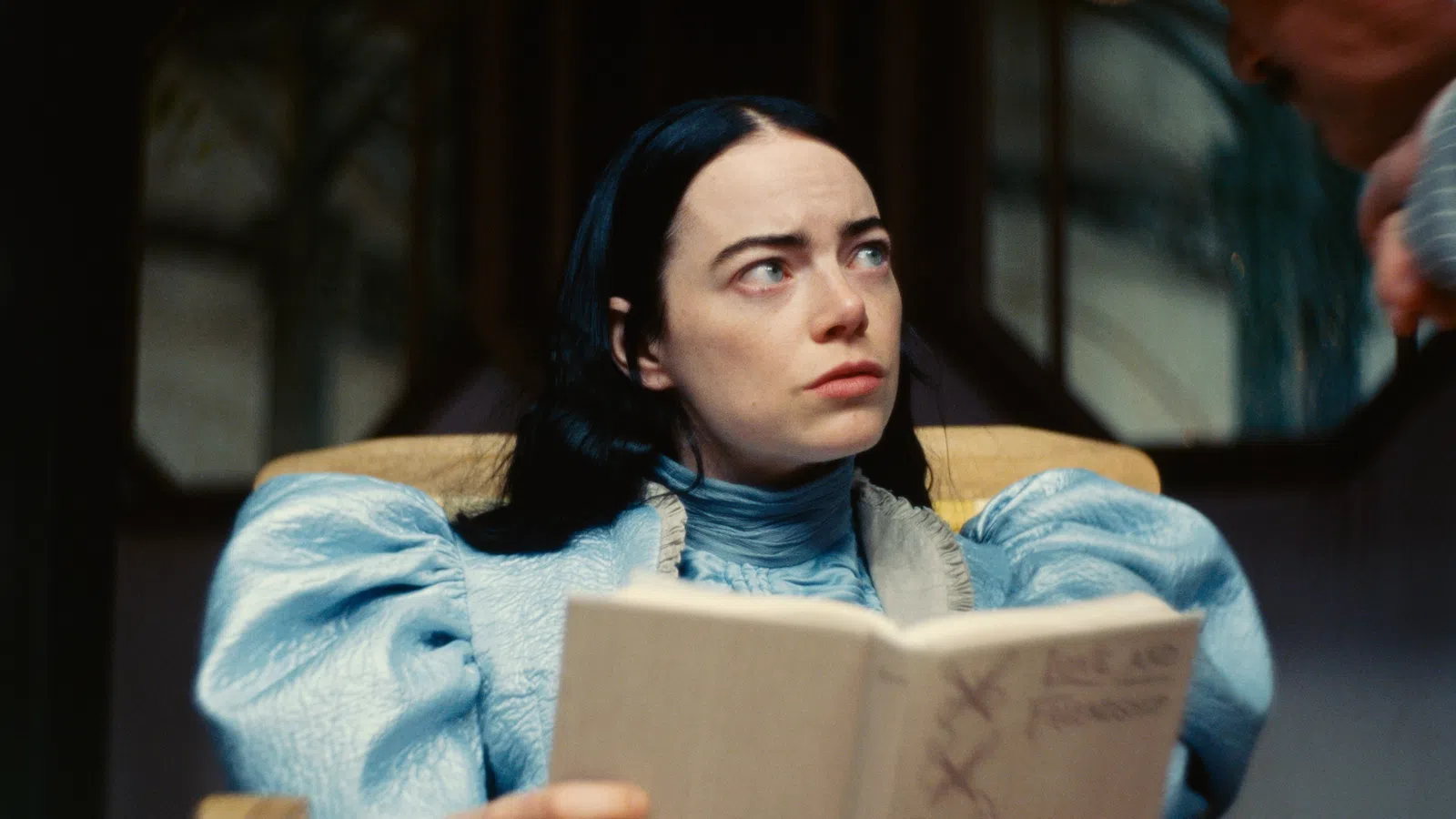 Emma Stone reading a book