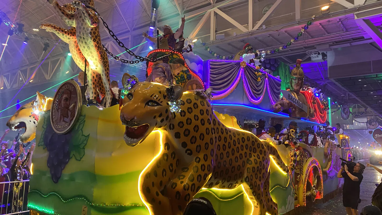 a group of people in a room with a carousel
