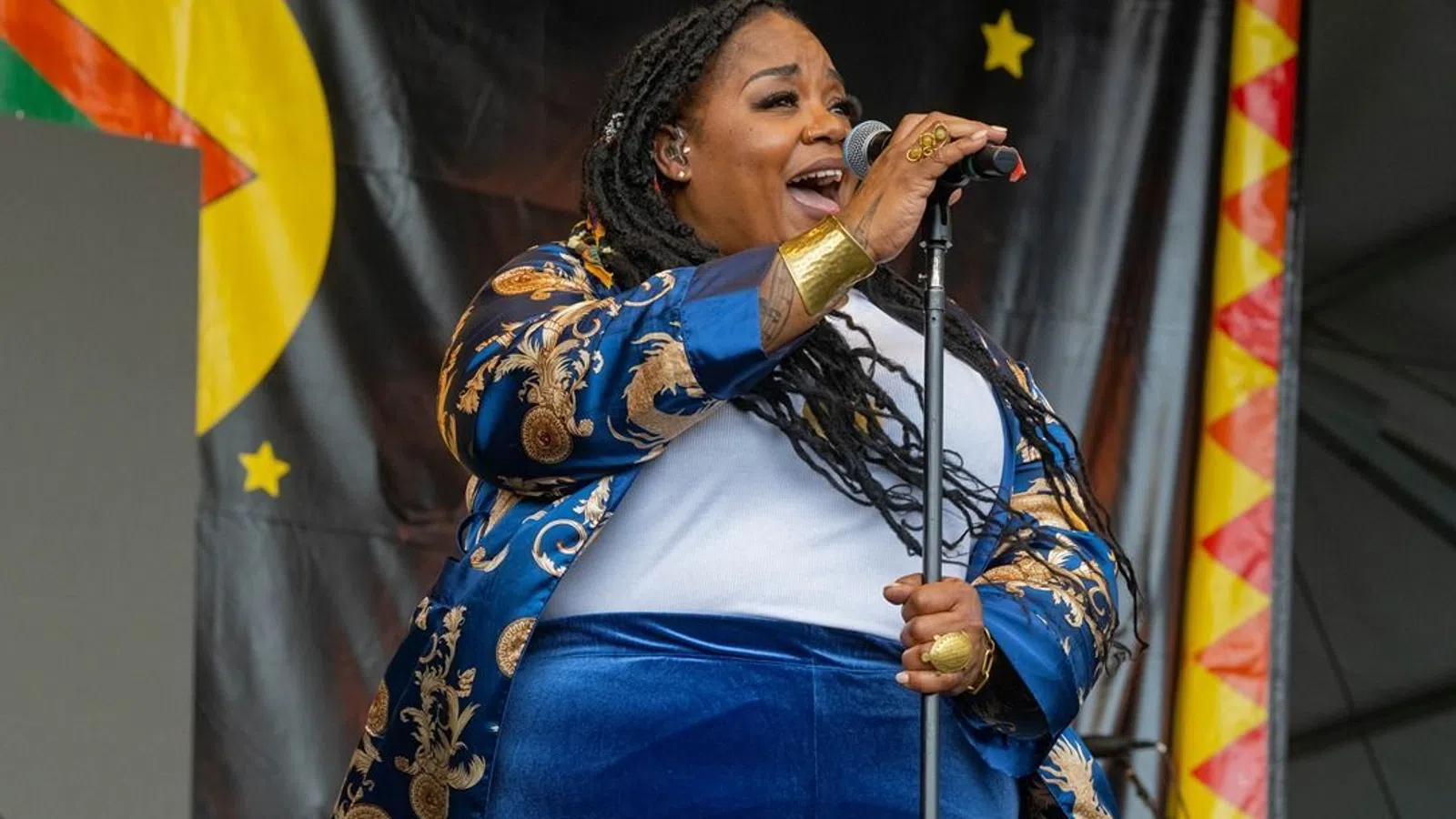 a person singing into a microphone