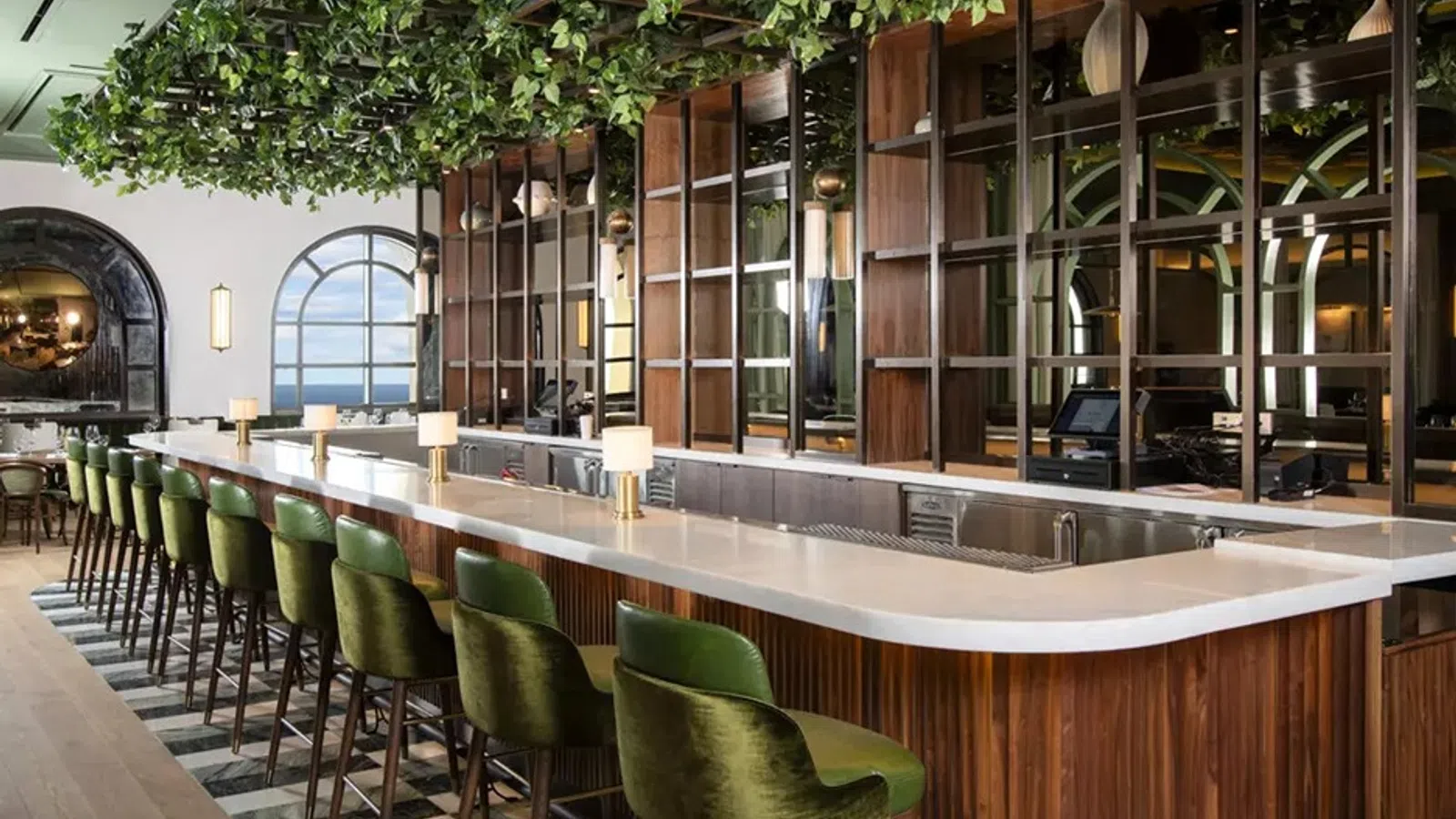 a bar with green chairs