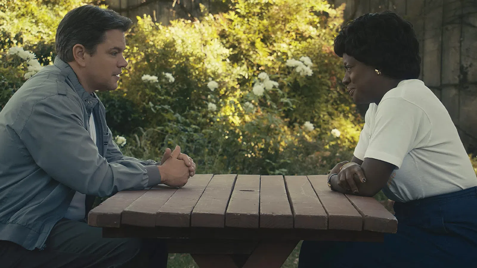 a man and a woman playing a game outside