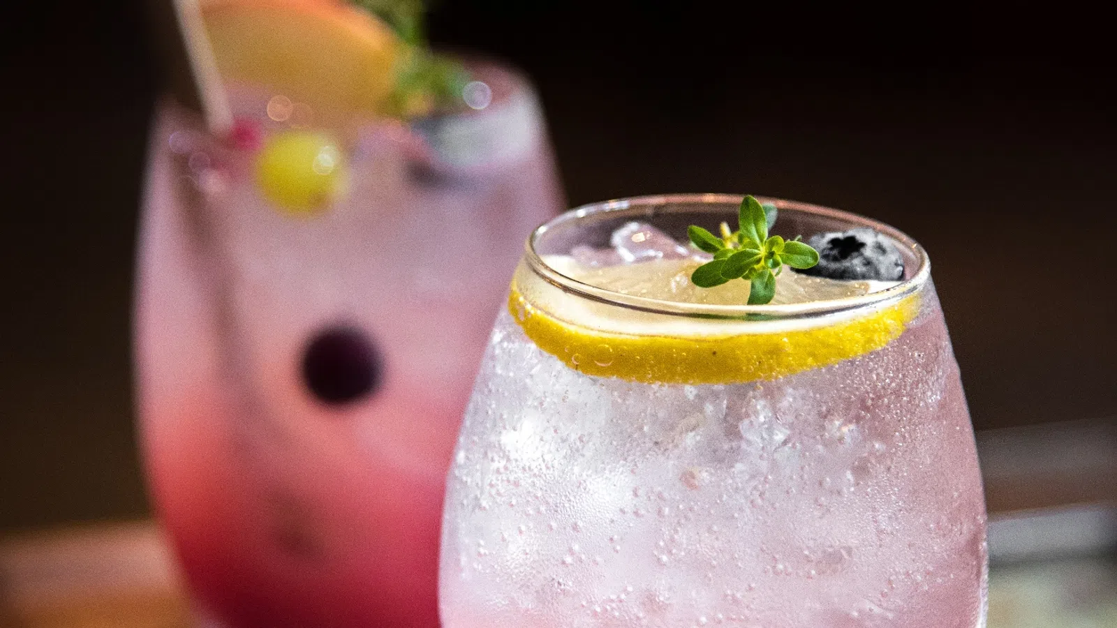 a couple of drinks with straws