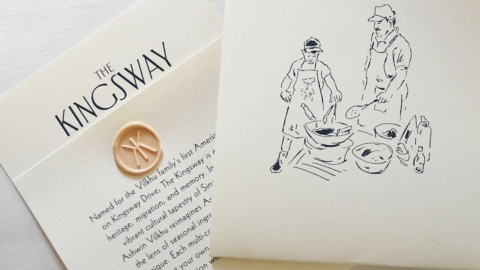 The Kingsway card with a wax seal and a sketch of two people cooking together on cream paper.