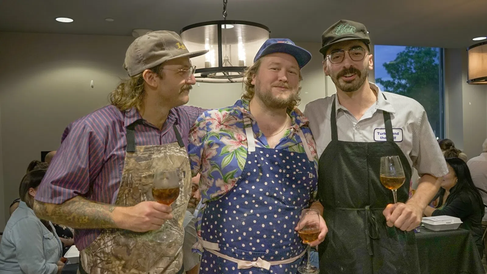 a group of men holding wine glasses