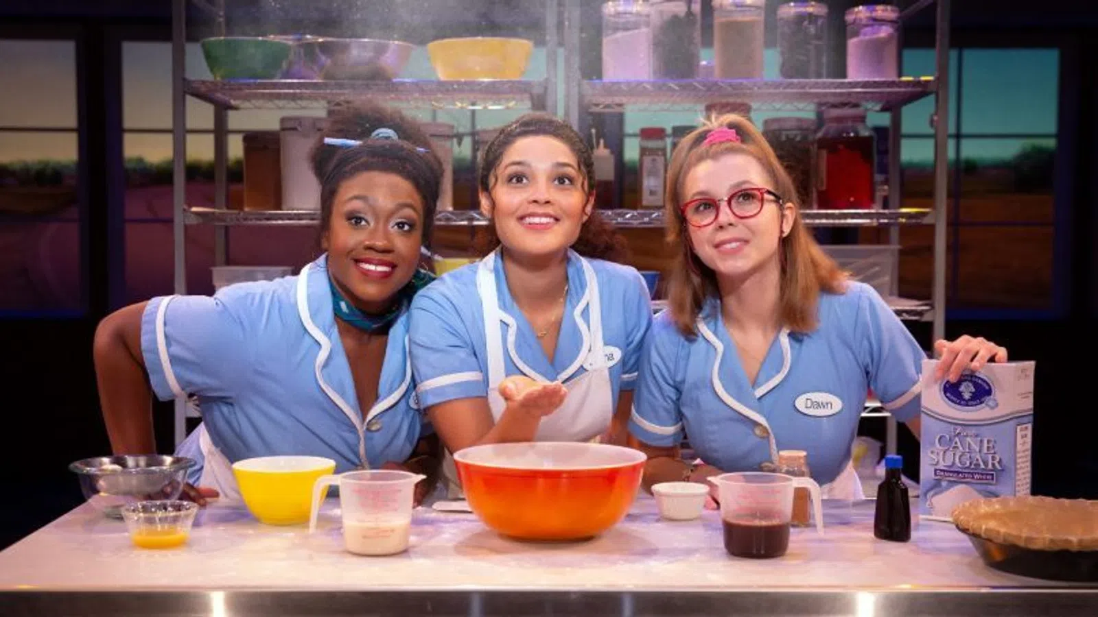 a group of girls in blue shirts