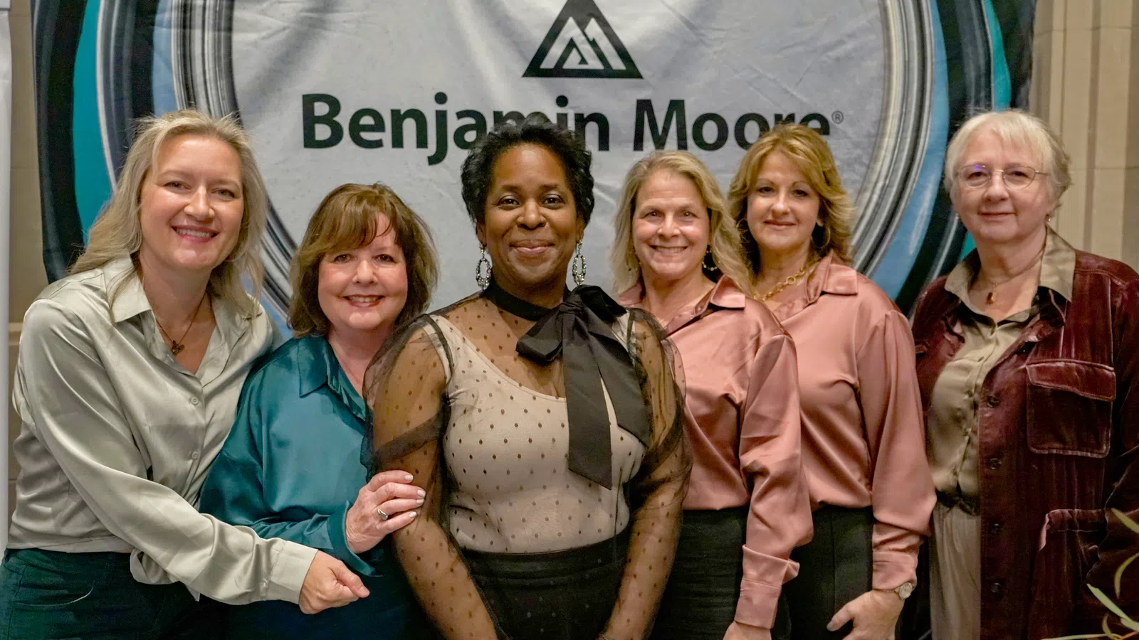 a group of women posing for a photo