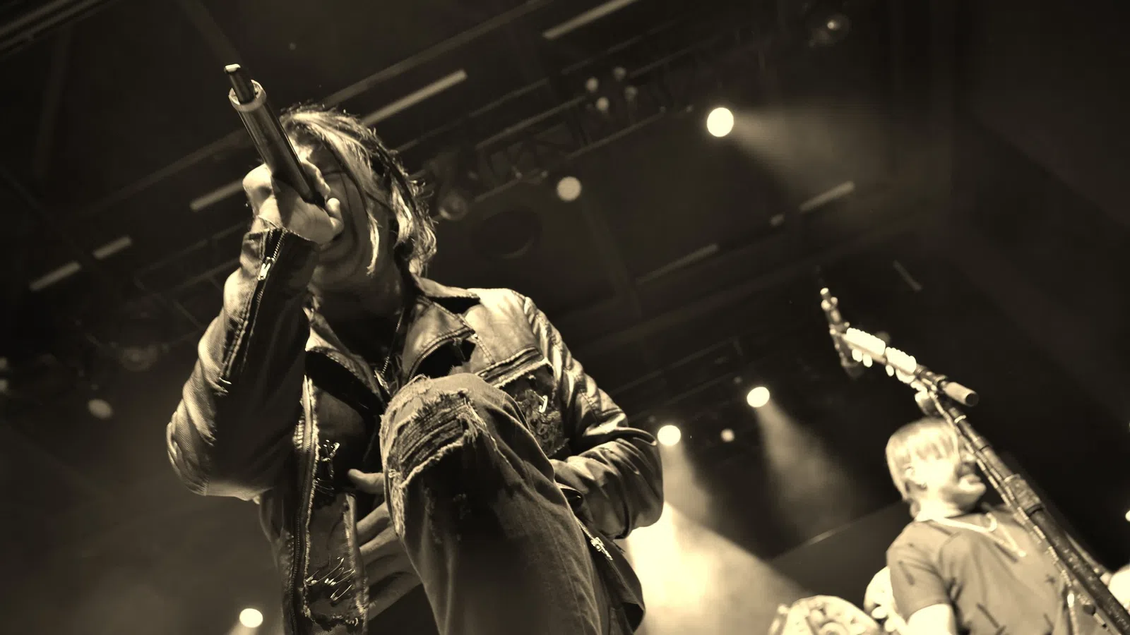 a person singing into a microphone
