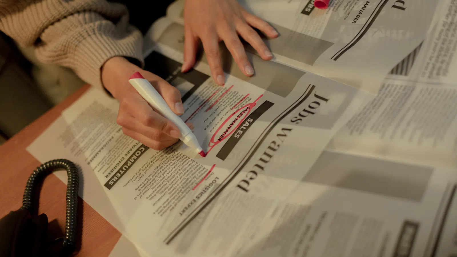 a person writing on a piece of paper