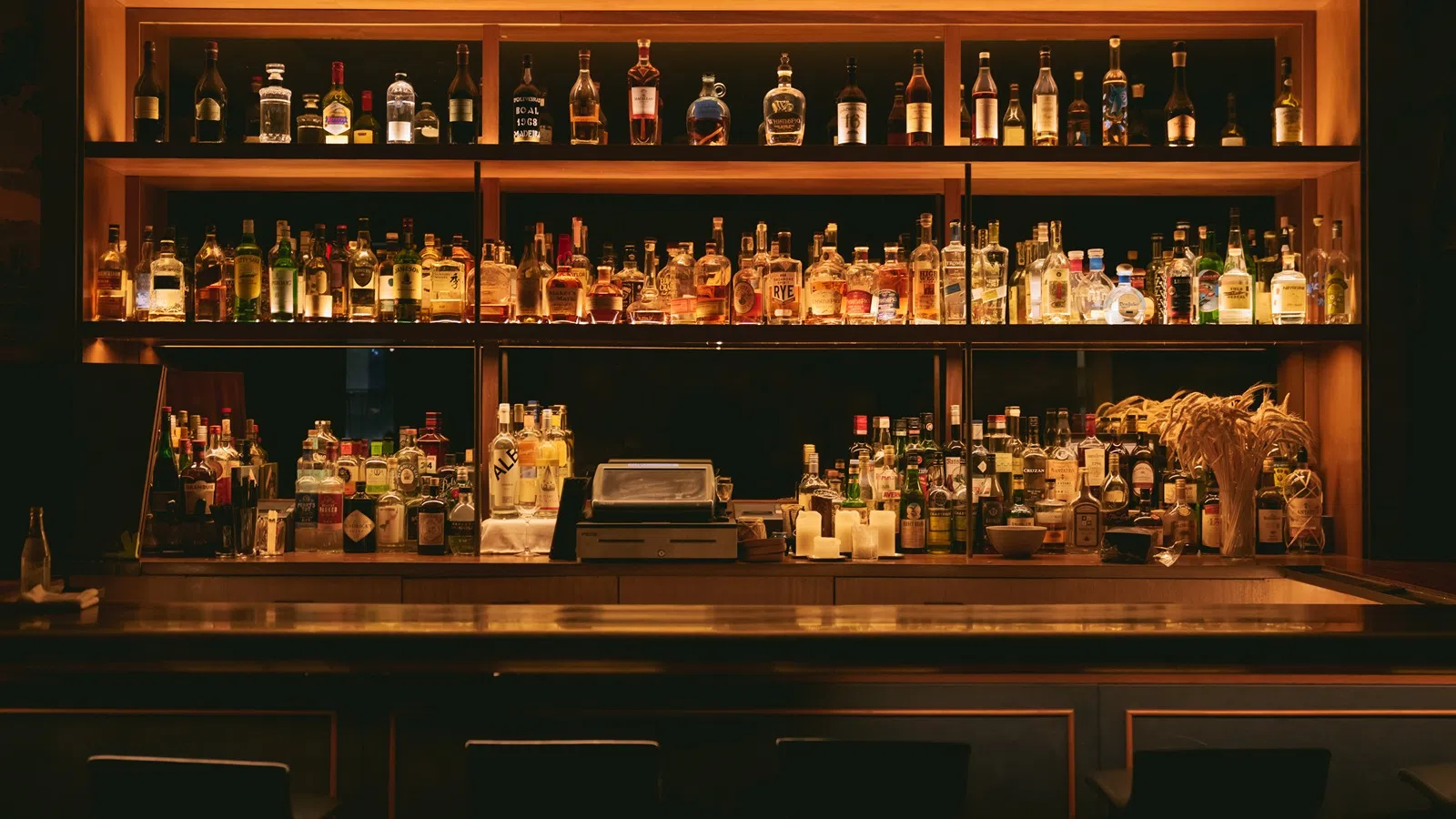 a bar with many bottles of alcohol