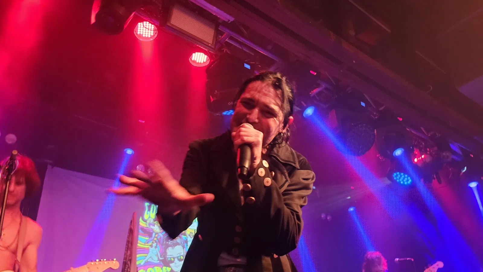 a person singing into a microphone
