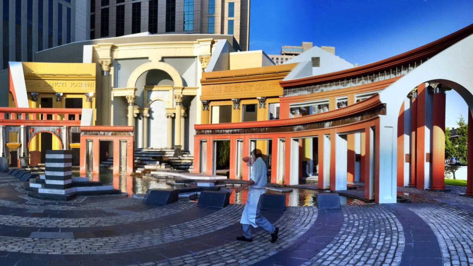 a person walking in front of a building