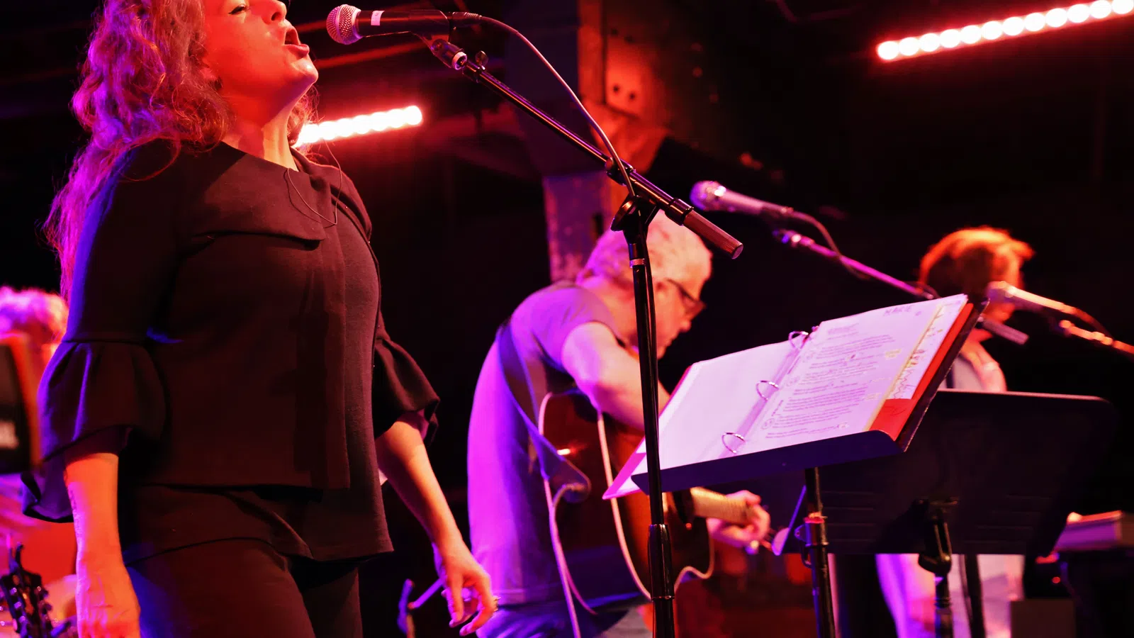 a man and woman playing instruments